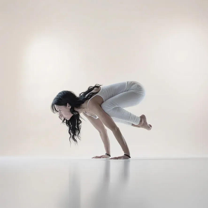 MRY Basic: a yogini in crow pose, bakasana