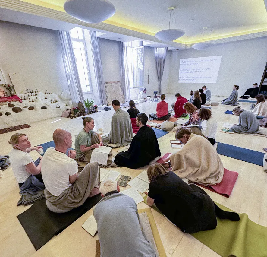 Course participants with notes on their mats